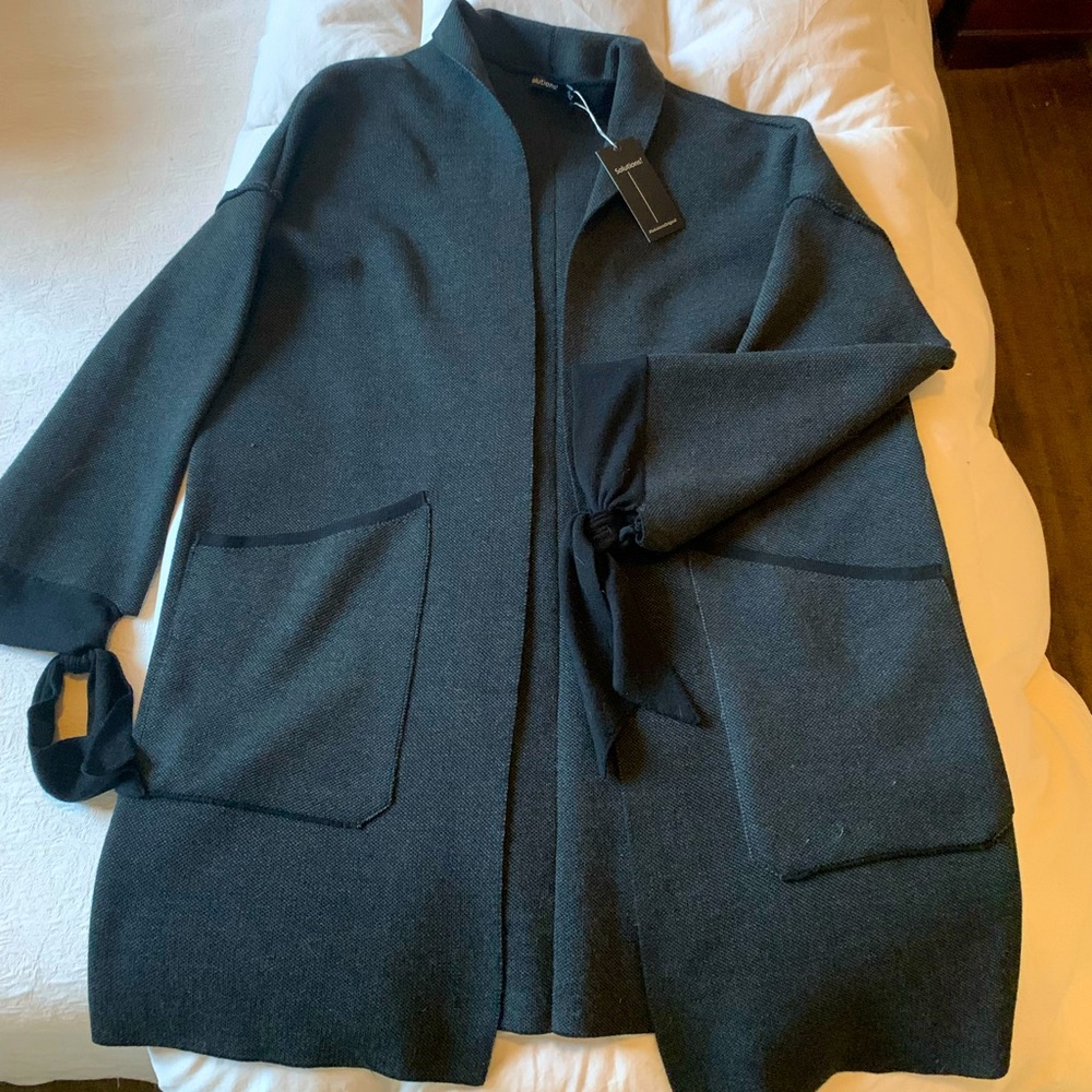 Nordstrom open jacket with ribbon cuffs.